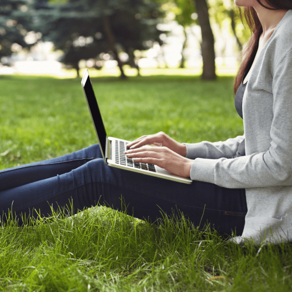 Working outside on a laptop.